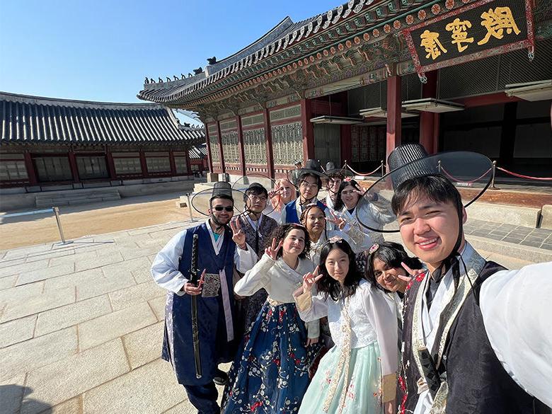 students smile for group photo